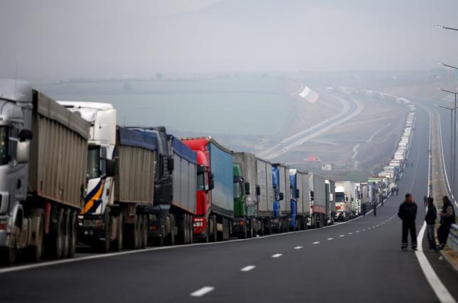 Trucks are seen on a highway near the Kulata border crossing between Bulgaria and Greece, Bulgaria February 17, 2016. REUTERS/Stoyan Nenov